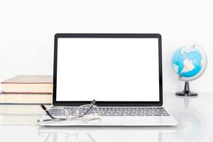 Laptop mockup with blank screen on table photo