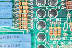 Condensers and Resistor assembly on the circuit board photo