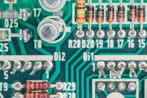 Condensers and Resistor assembly on the circuit board photo