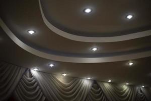 Lamps in ceiling. Multi-level ceiling. Interior design. photo