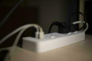 Charger. Socket for electricity. Wires in electrical network. photo