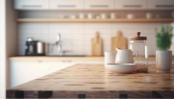 Empty table top over defocused kitchen with copy space photo