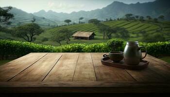 Empty wooden table with a view of blurred tea plantation background photo