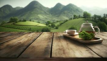 Empty wooden table with a view of blurred tea plantation background photo