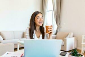 Happy young woman in headphones speaking looking at laptop making notes, girl student talking by video conference call, female teacher trainer tutoring by webcam, online training, e-coaching concept photo