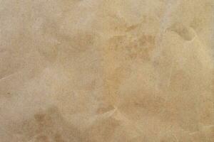 crumpled brown paper background and texture with copy  space. photo