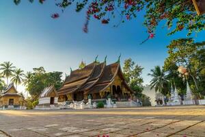 Wat Xieng Thong Golden City Temple in Luang Prabang, Laos. Xieng Thong temple is one of the most important of Lao monasteries. photo