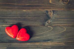 two red heart on wood table background with copy space photo