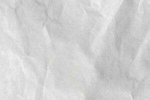 close up crumpled white paper texture and background photo