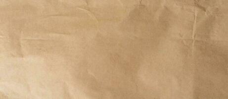 crumpled brown paper background and texture with copy  space. photo