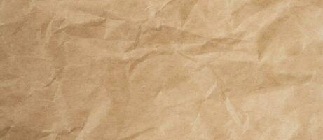 Close up crumpled brown paper texture and background with copy space photo