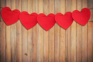 Red heart hanging on Wood Background and Texture vertical. photo