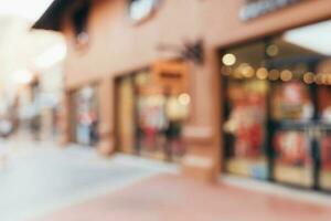 Vintage tone blurred defocused day of crowd people in walking street festival and shopping mall. photo