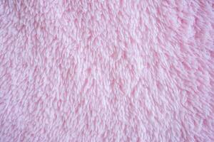 Pink color and wool texture and background photo