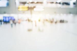 abstract blurred background  crowd people at terminal department at airport with bokeh light. photo