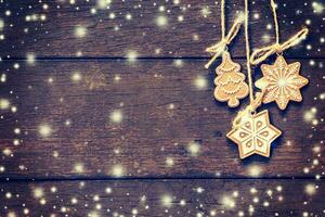 Christmas decoration hanging on snow wood background with copyspace. photo