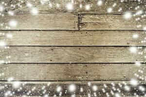 Above snow on wood board background and texture with space for text. photo