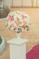 Colorful decoration artificial flower with vintage toned. photo