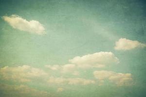 Vintage clouds and blue sky with texture effect. photo