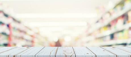 Empty wood table and blurred light table in shopping mall with bokeh background. product display template. photo