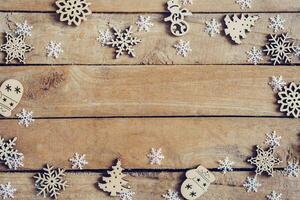 Wooden brown christmas background with snowflakes and christmas decoration. photo