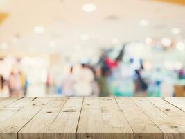 Empty wood table and Blurred background image. supermarket blur background with space display montage for product. photo