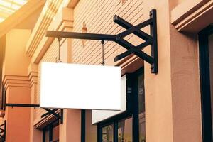 horizontal black empty signage on clothes shop front with copy space. photo