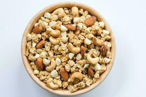 Bowl of Muesli and granola Isolated on White Top View. photo