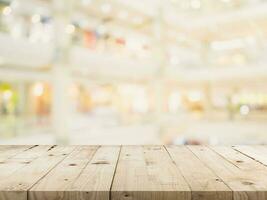 Empty wood table and Blurred background image. supermarket blur background with space display montage for product. photo
