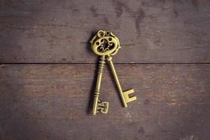 Old key vintage on wood background and texture with space.