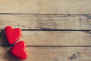 two red heart on wood table background with copy space photo