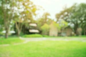 defocused bokeh and blur background of garden trees in sunlight. photo