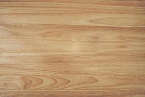 wood brown grain texture, dark wall background, top view of wooden table with copy space. photo