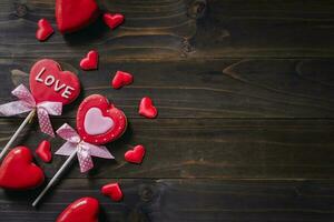 Valentines day heart shaped cookies on wooden table background with copy space. photo