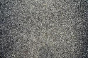 Close up of asphalt road background texture of rough. photo