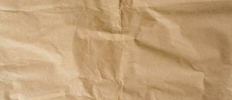 crumpled brown paper background and texture with copy  space. photo