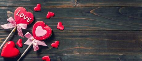 Valentines day heart shaped cookies on wooden table background with copy space. photo