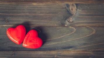 two red heart on wood table background with copy space photo