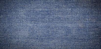 panorama of old blue jeans background and texture photo