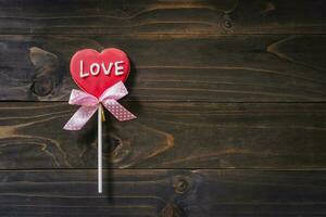 Valentines day heart shaped cookies on wooden table background with copy space. photo