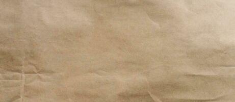 crumpled brown paper background and texture with copy  space. photo