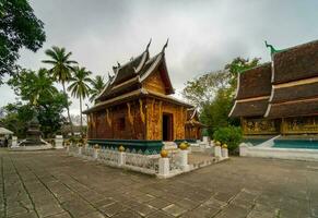 Wat Xieng Thong Golden City Temple in Luang Prabang, Laos. Xieng Thong temple is one of the most important of Lao monasteries. photo