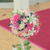 Colorful decoration artificial flower with vintage toned. photo