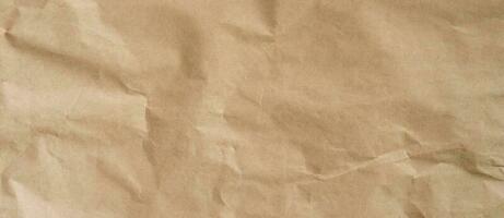 crumpled brown paper background and texture with copy  space. photo