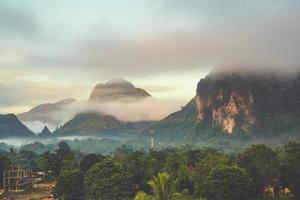 Beautiful sunrise and white mist with mountain at Vang vieng, Laos. photo