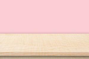 Empty wooden table and pink wall background texture, display montage with copy space. photo