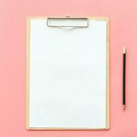 Blank clipboard and pencil mock up on pink pastel color background photo