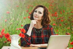 Beautiful woman or business woman talking on a cell phone outside. Outdoor portrait of a beautiful happy businesswoman talking on cell phone. photo