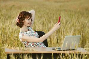 Beautiful woman or business woman talking on a cell phone outside. Outdoor portrait of a beautiful happy businesswoman talking on cell phone. photo