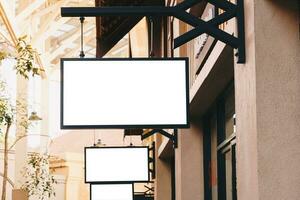 horizontal black empty signage on clothes shop front with copy space. photo